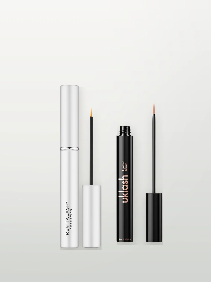 RevitaLash and UKLASH eyelash serums on a neutral background